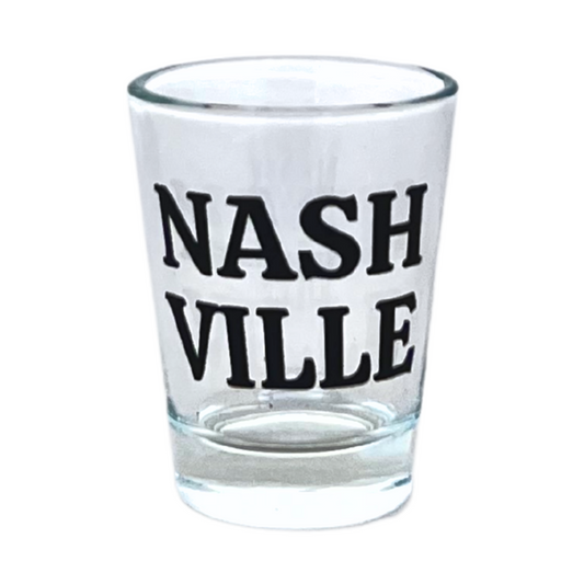 Standard 1 oz shot glass, designed in Nashville, Tennessee. Features "Nashville" in black on a clear shot glass.